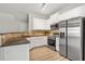 Modern kitchen featuring stainless steel appliances and granite countertops at 805 Pleasant Hill Rd # 171, Lilburn, GA 30047