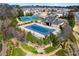 Aerial view of a neighborhood pool and tennis courts at 131 Riverside Ln, Woodstock, GA 30188