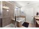 Modern bathroom with glass enclosed shower, soaking tub, and linen closet at 131 Riverside Ln, Woodstock, GA 30188