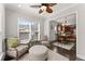 Bright breakfast nook with window views to the front yard and access to the kitchen at 131 Riverside Ln, Woodstock, GA 30188