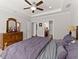 Spacious main bedroom features trey ceiling, ceiling fan and ensuite bath at 131 Riverside Ln, Woodstock, GA 30188