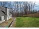 Spacious backyard featuring a well-maintained lawn and a privacy fence at 255 Olde Oak Dr, Jonesboro, GA 30238