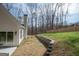 Spacious backyard with retaining wall and wooded area at 255 Olde Oak Dr, Jonesboro, GA 30238