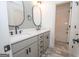 Bathroom featuring double vanity sinks and access to the toilet and shower at 255 Olde Oak Dr, Jonesboro, GA 30238