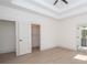 Large bedroom with walk-in closet, ensuite bath, and light wood floors at 255 Olde Oak Dr, Jonesboro, GA 30238