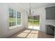 Dining area with a large window and sliding glass doors leading to the backyard at 255 Olde Oak Dr, Jonesboro, GA 30238