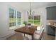 Dining area featuring large windows with backyard views at 255 Olde Oak Dr, Jonesboro, GA 30238