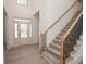 Welcoming entryway with staircase, lots of natural light, and wood-look floors at 255 Olde Oak Dr, Jonesboro, GA 30238