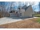 Exterior of home featuring three-car garage, concrete driveway, and lush lawn at 255 Olde Oak Dr, Jonesboro, GA 30238