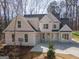 Charming two-story home with a covered front porch and large windows at 255 Olde Oak Dr, Jonesboro, GA 30238