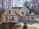 Charming two-story home with attached garage and inviting front entrance nestled in a wooded lot at 255 Olde Oak Dr, Jonesboro, GA 30238