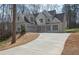 Charming home featuring attached garage, manicured lawn, and extra long driveway at 255 Olde Oak Dr, Jonesboro, GA 30238