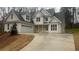 Charming two-story home with a two car garage and a long concrete driveway at 255 Olde Oak Dr, Jonesboro, GA 30238