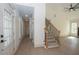 Bright foyer featuring a staircase with decorative iron railings and views into the living area at 255 Olde Oak Dr, Jonesboro, GA 30238