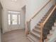 Bright foyer with stairs and decorative iron railings at 255 Olde Oak Dr, Jonesboro, GA 30238
