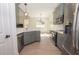 Modern kitchen with stainless steel appliances, quartz countertops and a peninsula at 255 Olde Oak Dr, Jonesboro, GA 30238