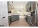 Modern kitchen featuring stainless steel appliances, a breakfast bar, and lots of natural light at 255 Olde Oak Dr, Jonesboro, GA 30238