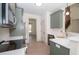 Stylish kitchen with modern appliances, white backsplash, quartz countertops, and view to stairs at 255 Olde Oak Dr, Jonesboro, GA 30238