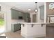 Modern kitchen with a breakfast bar, stainless steel appliances and light countertops at 255 Olde Oak Dr, Jonesboro, GA 30238