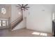 Spacious living room featuring high ceilings, a staircase and light wood-look flooring at 255 Olde Oak Dr, Jonesboro, GA 30238