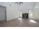 Open living room with fireplace and many windows for natural light at 255 Olde Oak Dr, Jonesboro, GA 30238