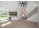 Open living space with high ceilings, fireplace, and connection to the kitchen at 255 Olde Oak Dr, Jonesboro, GA 30238