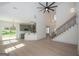 Open-concept living area with a staircase and a view into the kitchen at 255 Olde Oak Dr, Jonesboro, GA 30238