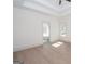 Spacious primary bedroom with tray ceiling, ample natural light, and access to the bathroom at 255 Olde Oak Dr, Jonesboro, GA 30238