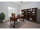 Office space featuring a large bookshelf, desk, and window at 255 Olde Oak Dr, Jonesboro, GA 30238