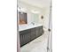 Bright bathroom with double vanity, modern fixtures, and gray cabinetry at 445 Griffin St, Atlanta, GA 30318