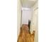 Hallway with wood flooring, light-colored walls, and doorways to other rooms at 445 Griffin St, Atlanta, GA 30318