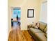 Cozy sitting room featuring hardwood floors and natural light from the windows at 445 Griffin St, Atlanta, GA 30318