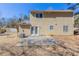 Wide shot of the backyard with a concrete patio at 554 Sherwood Oaks Rd, Stone Mountain, GA 30087