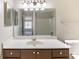 Bathroom featuring a sink, vanity, and shower-tub combo at 554 Sherwood Oaks Rd, Stone Mountain, GA 30087