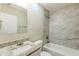 Bathroom featuring a tub with tiled shower, granite vanity, and modern mirror at 554 Sherwood Oaks Rd, Stone Mountain, GA 30087