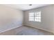 Bedroom featuring a window and neutral carpeting at 554 Sherwood Oaks Rd, Stone Mountain, GA 30087