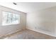 Bedroom featuring a window and neutral carpeting at 554 Sherwood Oaks Rd, Stone Mountain, GA 30087