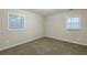 Neutral bedroom features wall to wall carpet and natural light from the window at 554 Sherwood Oaks Rd, Stone Mountain, GA 30087