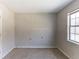 Bedroom featuring a window and neutral carpeting at 554 Sherwood Oaks Rd, Stone Mountain, GA 30087