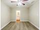 Bedroom with plush carpet, ceiling fan and a view to the bathroom at 554 Sherwood Oaks Rd, Stone Mountain, GA 30087