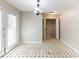 This dining area features tile floors, hanging light, and door with blinds at 554 Sherwood Oaks Rd, Stone Mountain, GA 30087