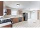 Eat-in kitchen featuring vintage cabinets and black appliances at 554 Sherwood Oaks Rd, Stone Mountain, GA 30087