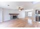 Living room featuring fireplace and kitchen access at 554 Sherwood Oaks Rd, Stone Mountain, GA 30087