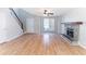 Living room with fireplace and staircase at 554 Sherwood Oaks Rd, Stone Mountain, GA 30087