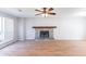 Living room with fireplace and large window at 554 Sherwood Oaks Rd, Stone Mountain, GA 30087