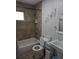 Neat bathroom featuring a shower-tub combo, a sink, and decor that adds a personal touch at 561 Formwalt Sw St # 12, Atlanta, GA 30312