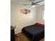 Minimalist bedroom features a comfy bed, desk, and modern ceiling fan at 561 Formwalt Sw St # 12, Atlanta, GA 30312