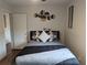 Comfortable bedroom with a decorative wall hanging, gray sheets, and an ensuite at 561 Formwalt Sw St # 12, Atlanta, GA 30312