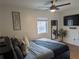 Cozy bedroom featuring a comfortable bed, ceiling fan, and modern décor at 561 Formwalt Sw St # 12, Atlanta, GA 30312