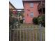 Pink two-story building with balcony and gated entry showcases unique architectural design at 561 Formwalt Sw St # 12, Atlanta, GA 30312